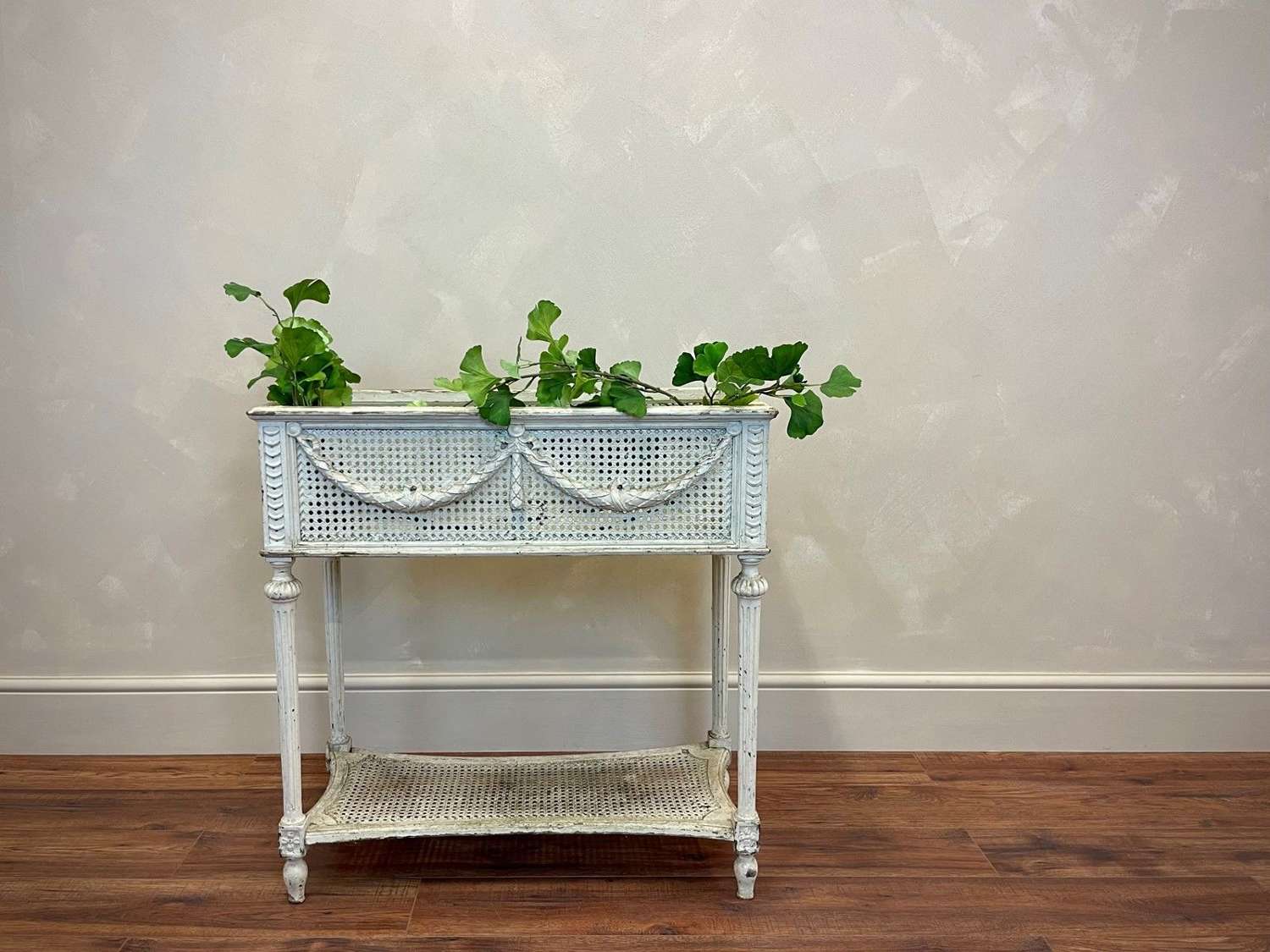 Painted wood and rattan plant stand