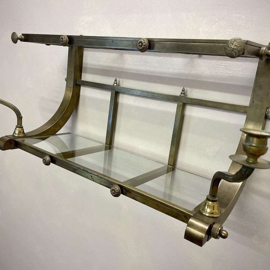 Early 20c Brass railway luggage rack and sconces.
