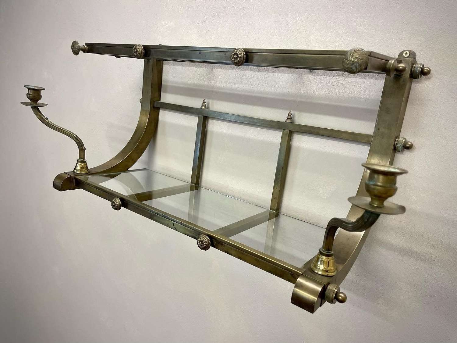 Early 20c Brass railway luggage rack and sconces.