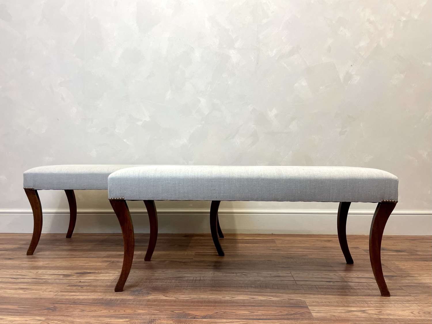 Pair of Upholstered Sabre Leg Benches