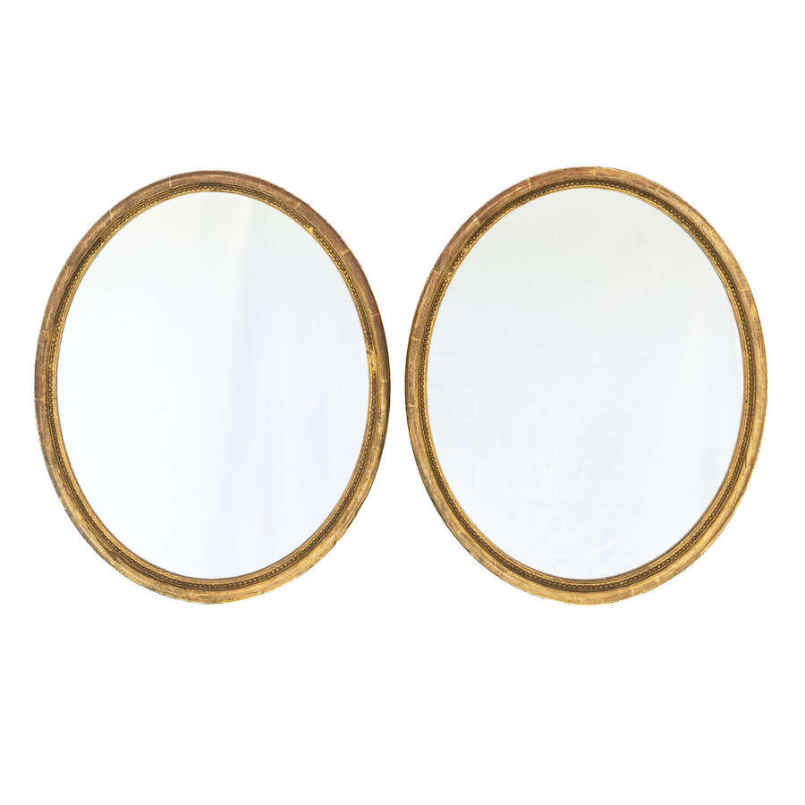 A Pair of 19th Century Gilt Oval Mirrors